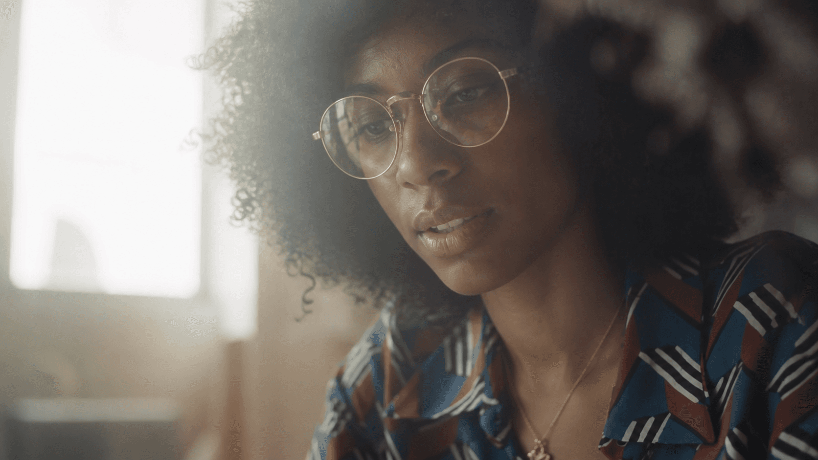 Black woman reviewing campaign layouts